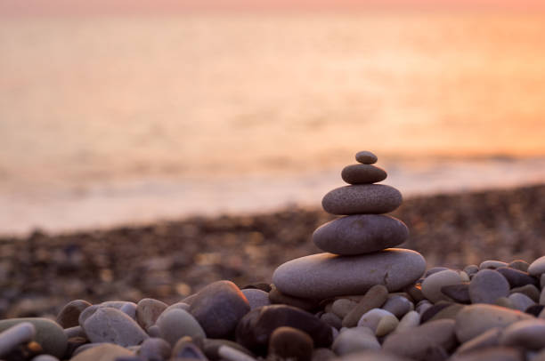 istock stack of zen stones on pebble beach 1162423999