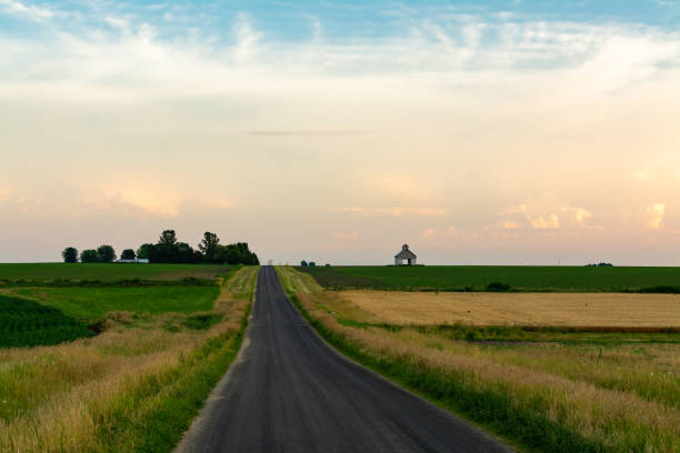 istock Open country road at sunset 1162424176