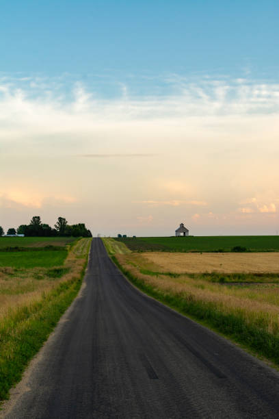 istock Open country road at sunset 1162424177
