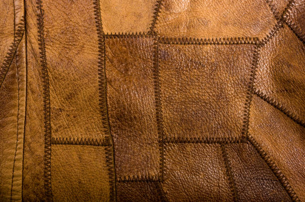 istock Old vintage genuine soft brown leather texture background, top layer with pores and scratches, macro, close-up 1162424182