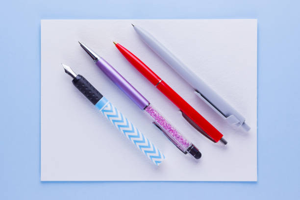 istock Back to school pop art concept. School stationery on pink blue background. Multicolored pens on pastel background. Flat lay. Copy space 1162425004