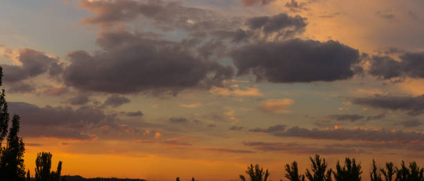 istock Landscape with dramatic light - beautiful golden sunset with saturated sky and clouds. 1162426231