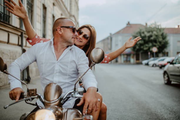 istock A couple goes on holiday with their scooter 1162426992