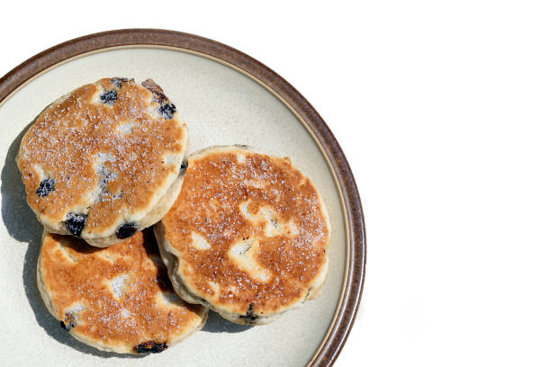istock Three Welsh Cakes on a plate isolated on a white background. 1162427538