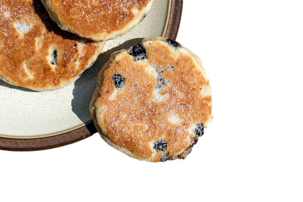 istock Welsh cakes - three welsh cakes on a plate with a white background. 1162427586