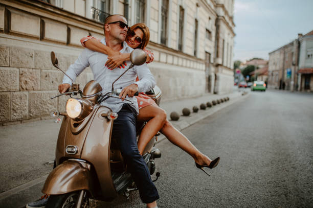 istock A couple goes on holiday with their scooter 1162429855