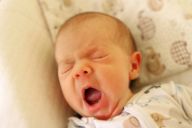 istock Cute newborn baby is yawing before going to bed. 1162431728