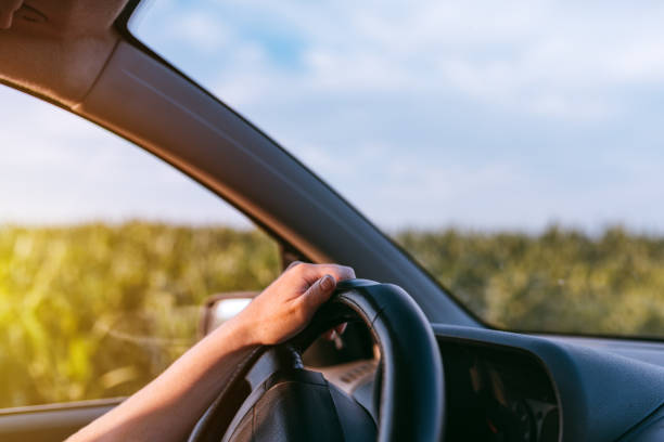 istock Driving car through countryside 1162432288