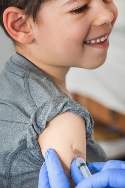 istock Cheerful boy receives a vaccination 1162434972