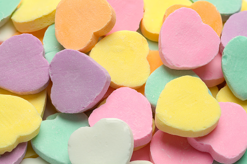 Blank Valentines Candy Heart Pile Close Up Background.