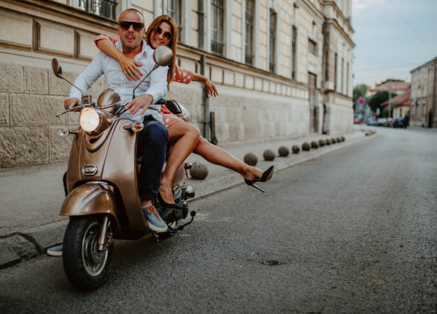 istock A couple goes on holiday with their scooter 1162435424