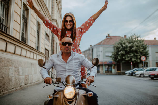 istock A couple goes on holiday with their scooter 1162436072