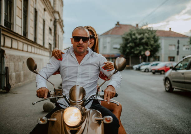 istock A couple goes on holiday with their scooter 1162437556