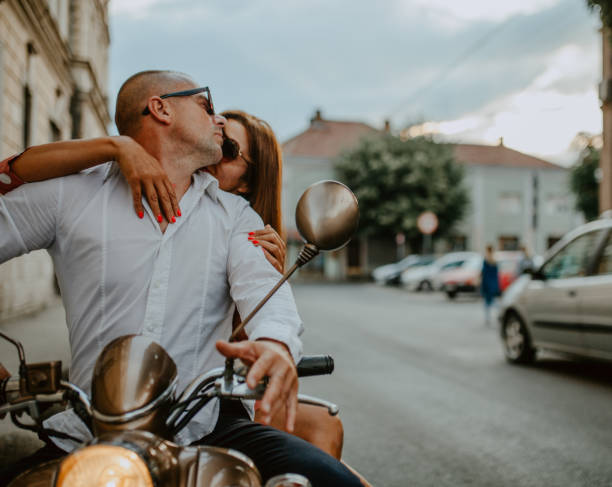 istock A couple goes on holiday with their scooter 1162437669