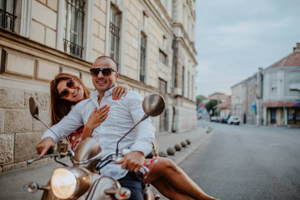 istock A couple goes on holiday with their scooter 1162437844