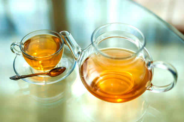 istock Transparent glass teapot and cup with spoon 1162438470