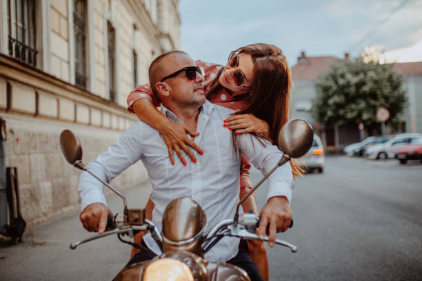 istock A couple goes on holiday with their scooter 1162438849