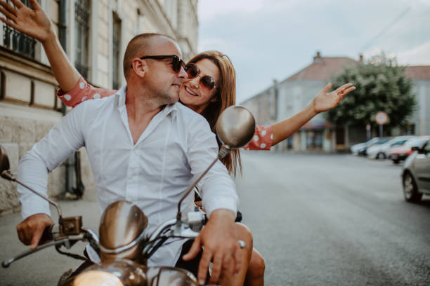 istock A couple goes on holiday with their scooter 1162438937