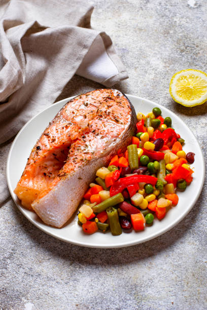 istock Baked salmon fillet with vegetables 1162439239