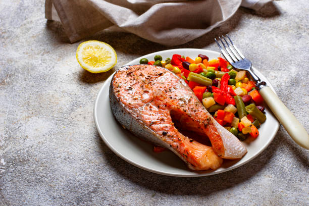 istock Baked salmon fillet with vegetables 1162439243
