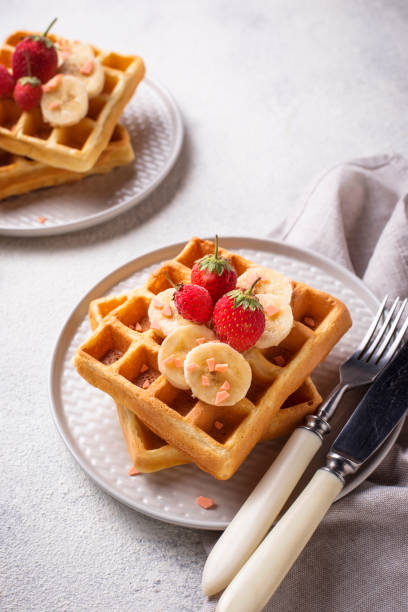 istock Waffles with strawberries and banana 1162439559