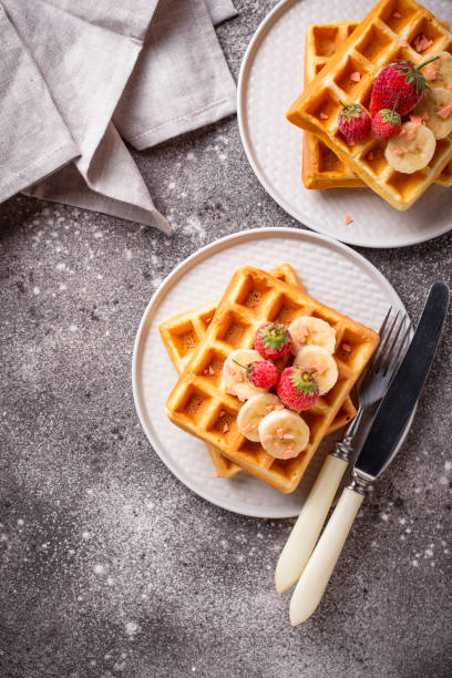 istock Waffles with strawberries and banana 1162439562