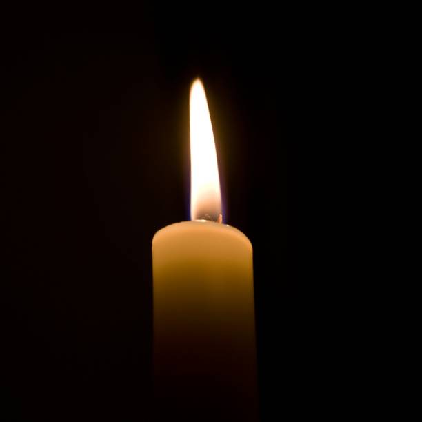 istock flame of a wax candle 1162439618