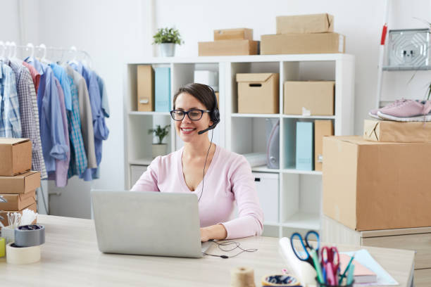 istock Young smiling helpdesk manager talking to clients online 1162440219
