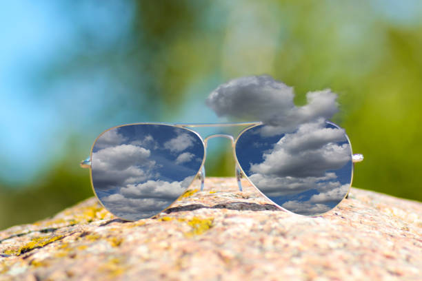 istock Rainy clouds reflection in sunglasses in summer time 1162440282
