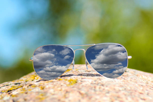Reflection of  cloudy sky in sunglasses