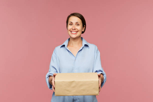 istock Young happy client of online shop with big packed box 1162440377