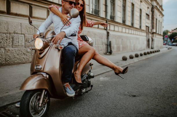 istock A couple goes on holiday with their scooter 1162440392