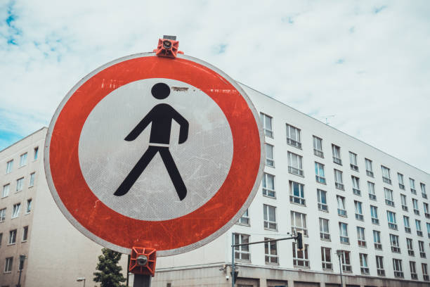 istock pedestrians traffic sign with red circle 1162441875