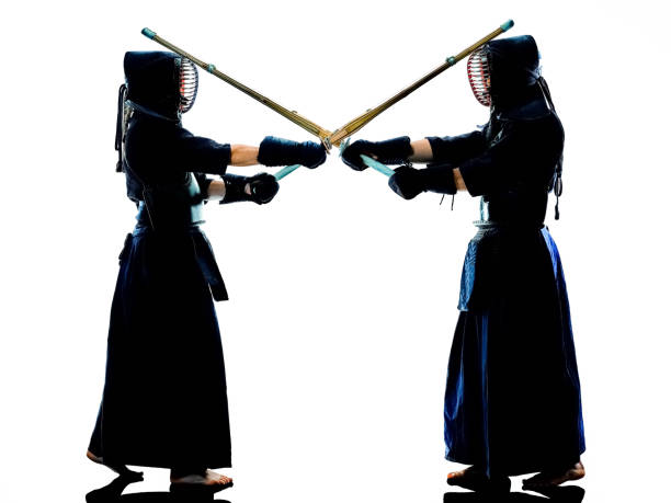 istock Kendo martial arts fighters silhouette isolated white bacground 1162447088
