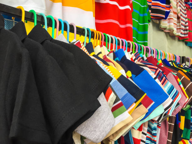 istock Many clothes hanging on a clothesline in a shop. 1162447451