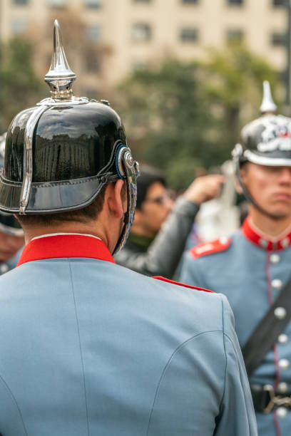 City: Santiago de Chile\nCountry Chile\n26/05/2019\nHeritage Day parade at Santiago de Chile city streets. Armed forces troops marching with musical instruments, iron helmets and military uniforms