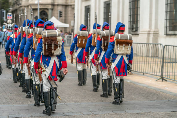 City: Santiago de ChileCountry Chile26/05/2019Heritage Day at Santiago de Chile city streets. Armed forces troops marching with classical blue, red and white uniforms and backpack walking formation