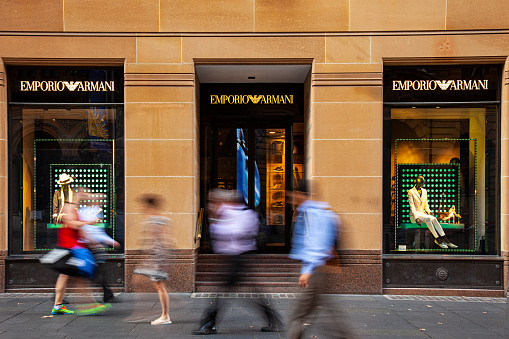 People walking passed the Emporio Armani flagship store at Martin Place, Sydney
