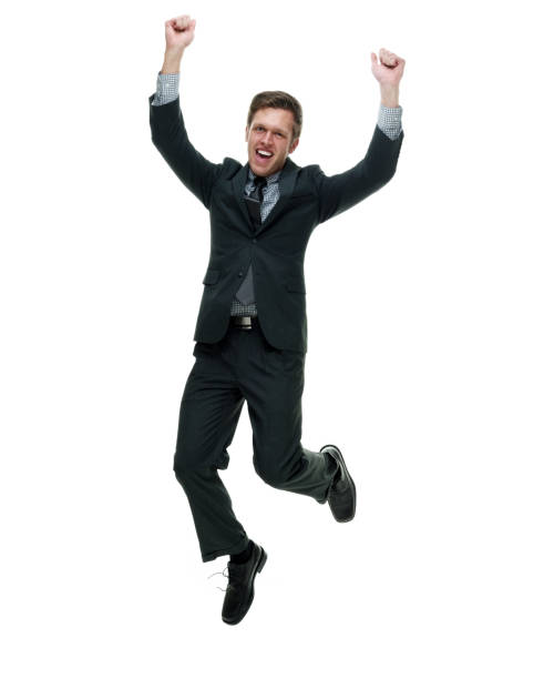 istock Businessman wearing a suit with necktie on white background jumping 1162453070