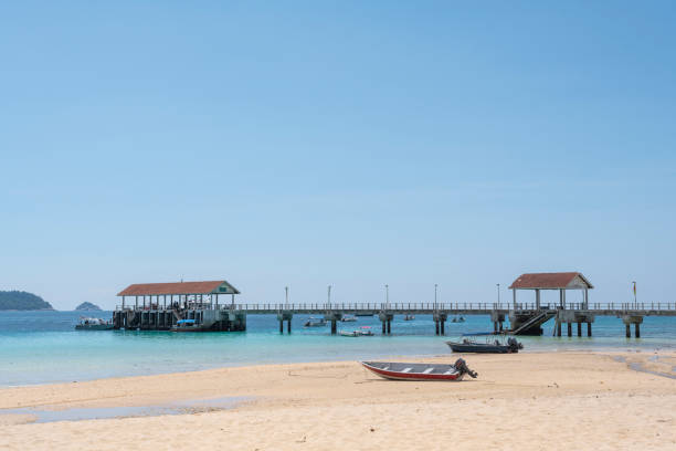istock Empty beach with couple of boats 1162453150