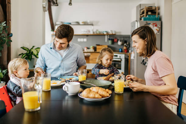 istock Young family is having breakfast together 1162453817