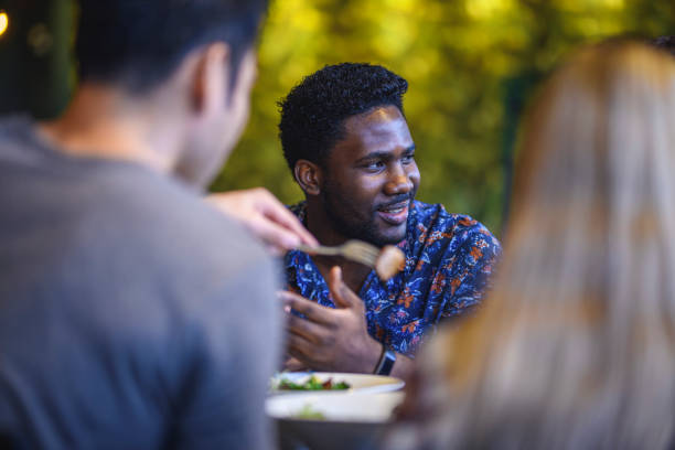 istock African Man Smiling in Conversation at Paleo Cafe 1162453875