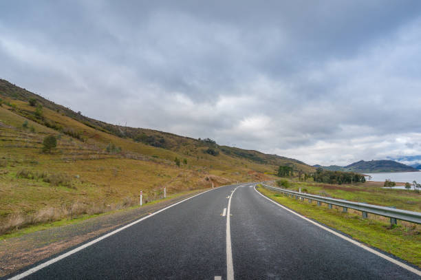 istock Outback asphalt road with white dividing lines 1162454225