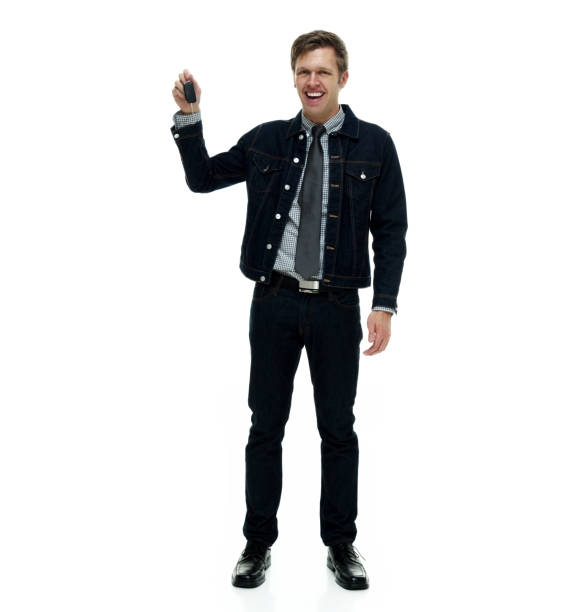 istock Handsome man wearing double denim is a hipster showing car keys 1162454395