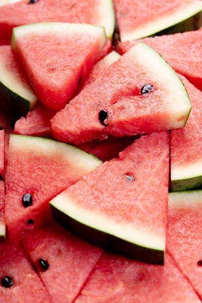 istock Slices of fresh watermelon covering as background 1162455414