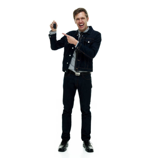 istock Handsome man wearing double denim is a hipster showing car keys 1162455560