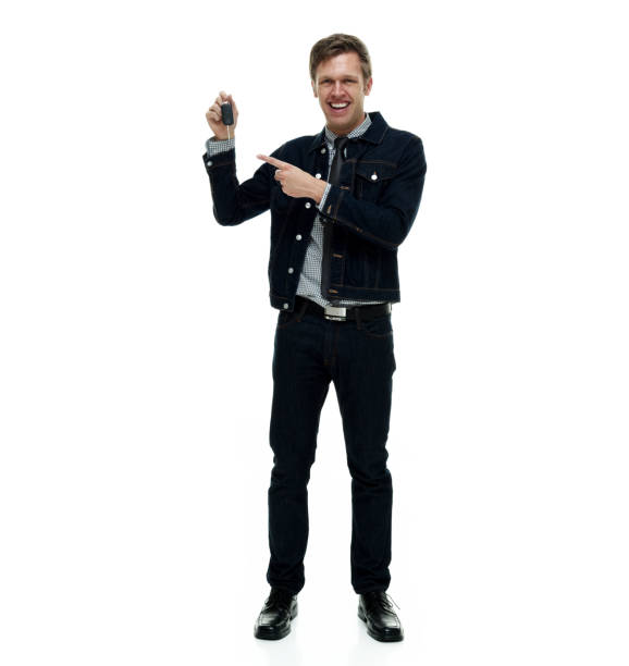 istock Handsome man wearing double denim is a hipster showing car keys 1162455729