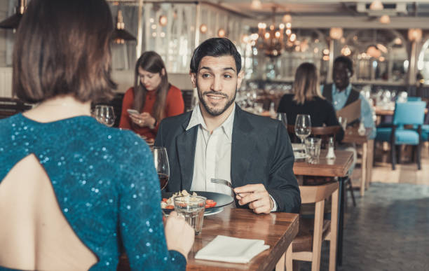 istock Cheerful man with female in restaurant 1162457513