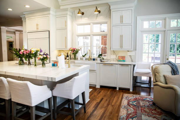 istock Open Concept Elegant and Spacious Kitchen with Marble Countertops and hardwood floors 1162457811
