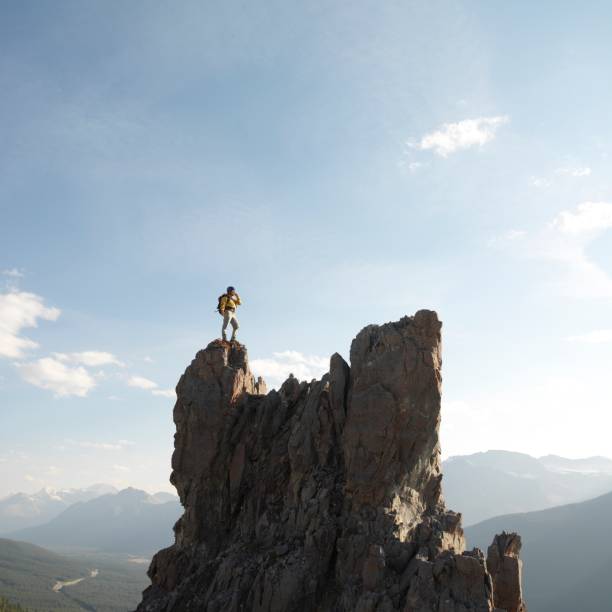 Young climber rock climbing